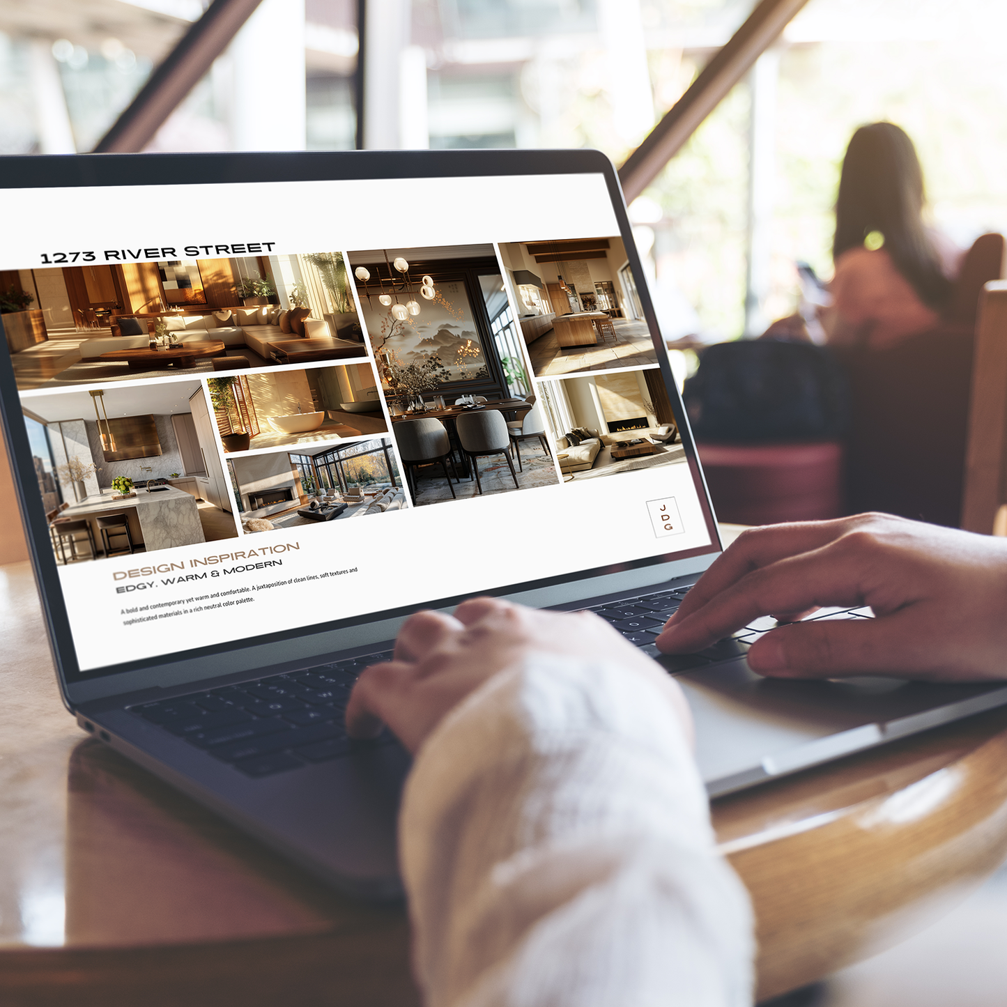 A person's hands using a laptop displaying an interior design inspiration image presentation with various rooms. From the LSI Workshop Jackson collection.