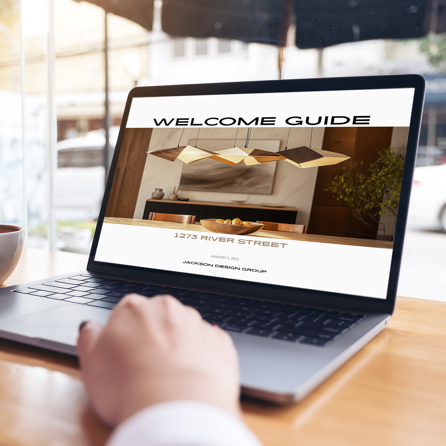 A laptop displaying the customizable New Client Welcome Guide for Interior Decorating Projects with placeholders for logo and imagery. From LSI Workshop, the Jackson Collection.